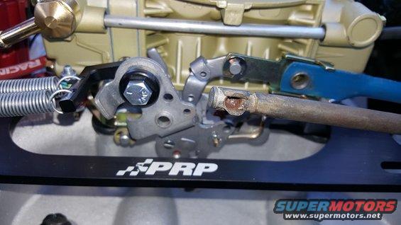 Close-up of carburetor linkage with PRP branding and Supermotors logo
