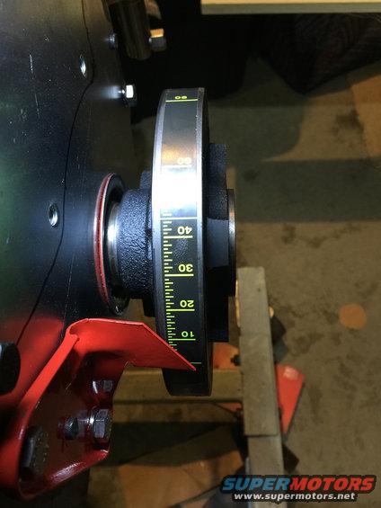Engine crankshaft pulley with timing marks indicating degrees