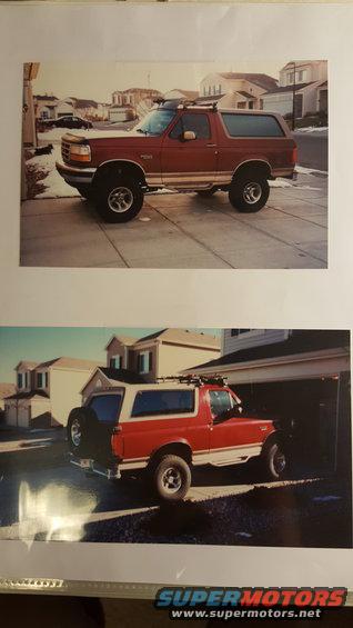 Red Ford Bronco parked in driveway, roof rack installed