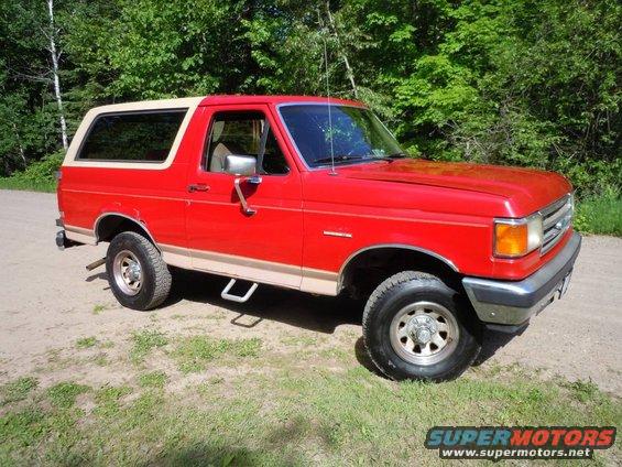 Red and tan 1989 Ford Bronco 3/4 front view