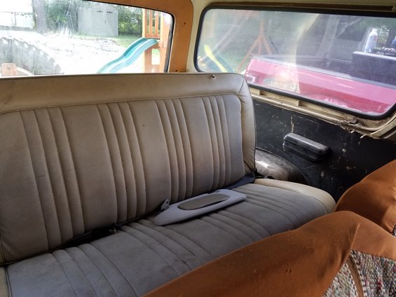 1979 Ford Bronco interior showing rear bench seat and door panel