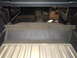 1967 Ford Mustang - The interior of a vehicle is shown, with the trunk area and rear seating area visible.
