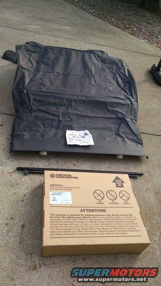 Black soft top and Chrysler box with soft top parts