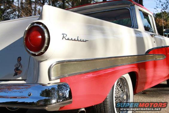 White and red 1958 Ford Ranchero with chrome bumper and wire wheels