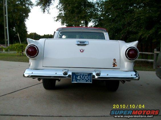 White 1957 Ford Fairlane Ranchero pickup truck rear view with chrome bumper and Alabama license plate