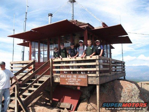 Group of children and an adult on the deck of Devils Head Fire Lookout tower