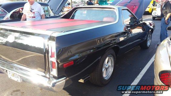 Black 1976 Ford Ranchero rear 3/4 view with red tonneau cover. License plate PJM6504