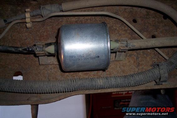 NAPA Gold 3097 fuel filter with part number 121115K1 visible