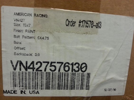 Label on a box with 'AMERICAN RACING VN427 Size: 15x7 Finish: PAINT Bolt Pattern: 5X4.75' and barcode VN427576130. Order #171570-a13. Made in USA. Date 12/27/10