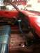 1964 Ford Fairlane - Car interior with blue seats and shifter, likely undergoing restoration or repair work.