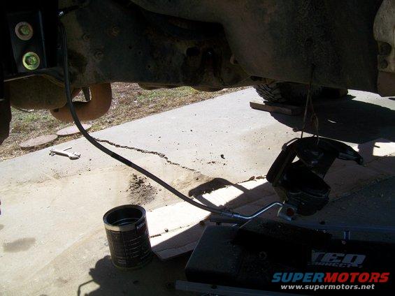 Undercarriage view of vehicle brake assembly and suspension components
