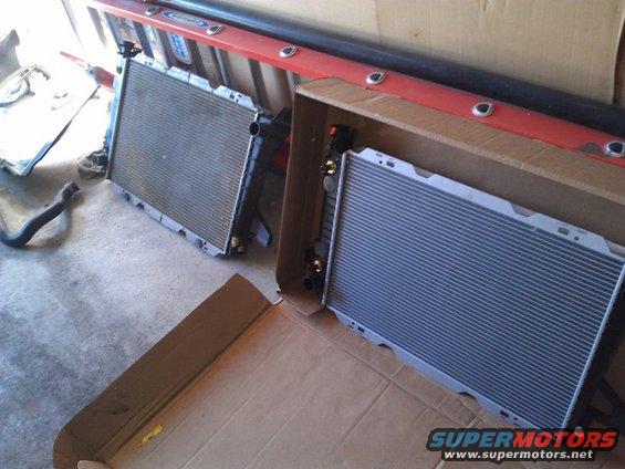 two vehicle radiators, one in a cardboard box