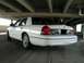 2000 Ford Crown Victoria - Rear view of a white 2000 Ford Crown Victoria parked in a garage.