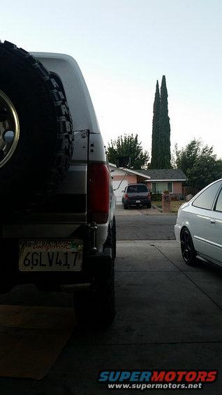 Silver 1992 Ford Bronco rear view with spare tire, California license plate 6GLV417
