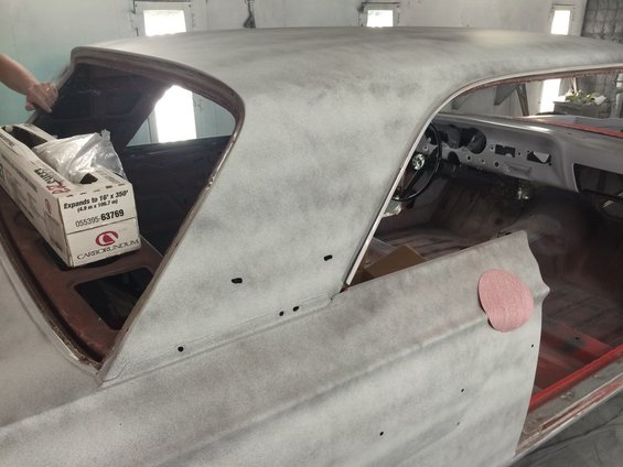 1964 Ford Fairlane interior and roof being prepped for paint, showing dashboard, steering wheel, and primer