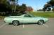 1972 Ford Ranchero - Side view of a 1972 Ford Ranchero parked in a lot on a sunny day.