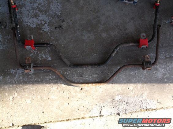 Two sway bars with red bushings