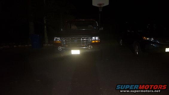 1992 Ford Bronco front view at night with headlights on