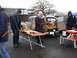 1969 Lincoln Continental - A wood-paneled station wagon is parked with its rear doors open, displaying items for sale.