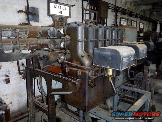 Industrial engine with pipes, "STATION N1" sign, and "PARTS TAKEN" label