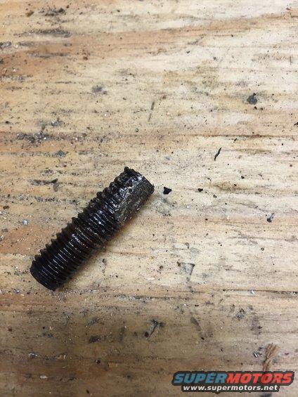 image_23.jpeg this broken exhaust manifold bolt put up a good fight but after 20-30 minutes i was able to prevail.  may he rust in pieces.

this was the only exhaust manifold bolt that broke off.  luckily it broke off after i had started unscrewing it, and it was still sticking out of the head.  to get it out, i had to use a grinder to flatten out the top and bottom of the threads and use vice grips to work it back and forth, about 1/3 of a turn each time.  i also used LOTS of liquid wrench.  after this one, i made extra sure i used lots of liquid wrench on all the other bolts too.  i think this one got stuck because of rust particles gumming up the threads.  i will be sure to use my bottoming tap on the rest of the threads for these bolts.  all will be replaced with appropriate length ARP stainless steel 12 point header bolts.