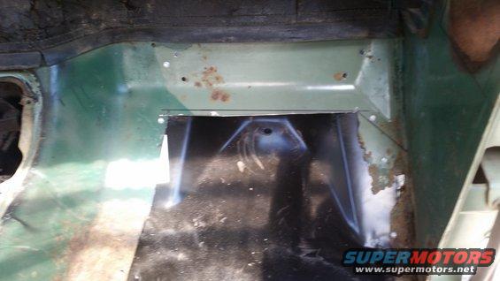 Interior floor panel with cut-out and rust spots