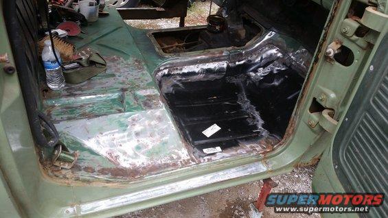 Green 1978 Ford Bronco interior with rust damage and repair work