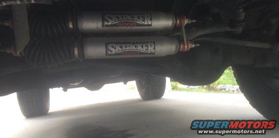 Underbody view showing two Skyjacker shocks and suspension components