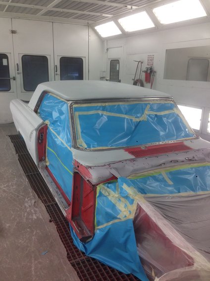 1964 Ford Fairlane coupe in paint booth, masked for painting