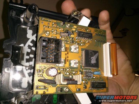 Circuit board with connectors and chips, held in hand