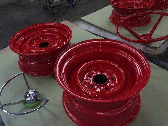 Red painted steel wheels and chrome steering wheel hub