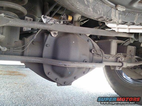 Rear axle differential assembly with suspension components visible above