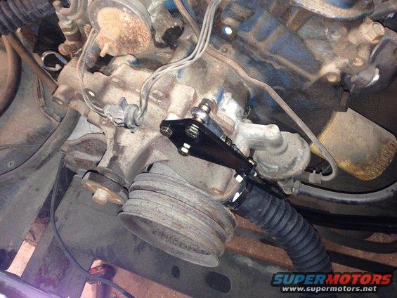 Close-up of steering linkage on engine