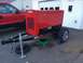 2006 Ford F-250 - A red 2006 Ford F-250 is parked next to a red welding generator on a trailer in a driveway.