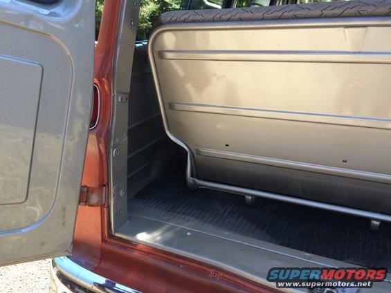 1962 Chevrolet Suburban interior with tan seats and orange exterior paint