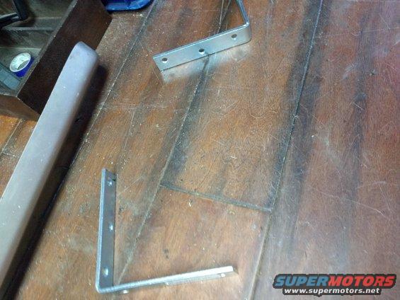 I found a couple L-angle pieces to use as a bit of extra support. They would be connected to each of the far holes.

I did end up having to cut a bit off of the bottom of each angle so it could fit correctly.