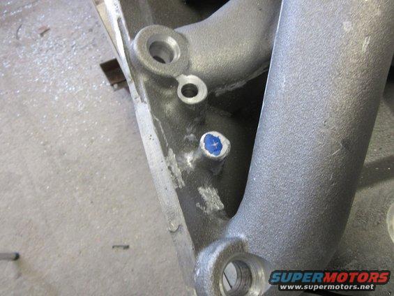 Close-up of intake manifold part with blue marker