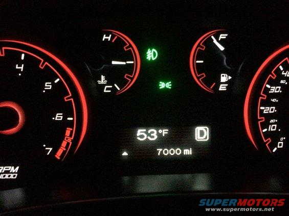 Dashboard with tachometer, speedometer, fuel gauge, temperature gauge, and digital display showing 53°F and 7000 miles