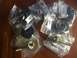 1978 Ford Bronco - Several new rubber mounts and bolts are packaged for sale, with part numbers and 'Made in Taiwan' visible on some labels.