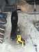 1978 Ford Bronco - Close-up view of a vehicle's frame component and a DeWalt reciprocating saw on a concrete surface.