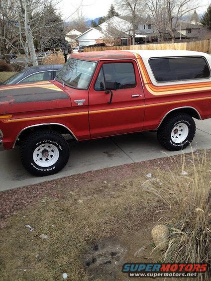1978 Ford Bronco side view, red with orange and yellow stripe accents