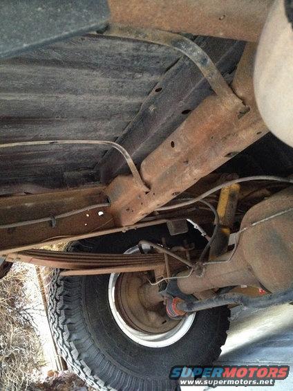1978 Ford Bronco rear axle, leaf springs, and frame components visible from underneath