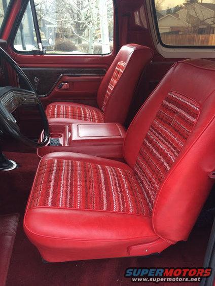 1978 Ford Bronco interior with red seats and plaid inserts