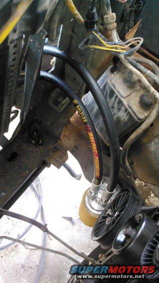 the hoses are running through the passenger side core support cutout and meeting at the filter. tho it doesnt appear to be, i have plenty of room between the hoses and the pulley of the engine.

the long hose from the engine has a swivel on this side. the hose from the cooler does not have the swivel