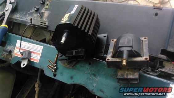 kimg0053.jpg the left is an Accel 'Ultracoil' which i will be using. it is a universal coil with a mount that will allow me to mount it remotely off the engine wherever i desire. the right is a stock ford TFI coil which is suppose to use a special bracket to hold it but i am no longer able to use the bracket. 

as you can see this Accel coil is quite large, larger than i expected but still usable. its rated for 60K volts which is quite abit more than the stock Ford coil. i dont plan on needing the extra power and dont think it will reach that using the extended stock wiring. this coil actually uses the same plug as the Ford TFI coil