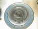1968 Mercury Cougar - A close-up view of a round air cleaner lid, showing its metallic surface and blue accent ring.