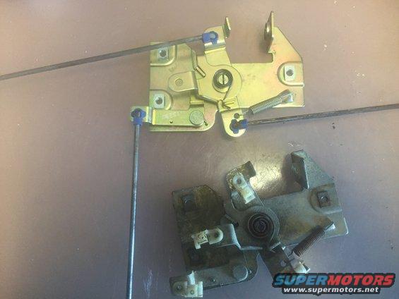 two car door latch mechanisms, one new and one old