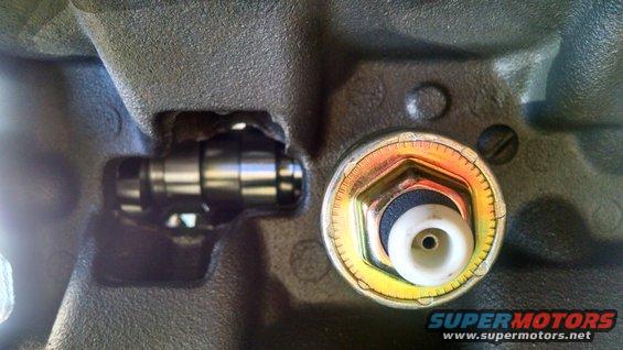 Close-up of an engine block with a sensor installed