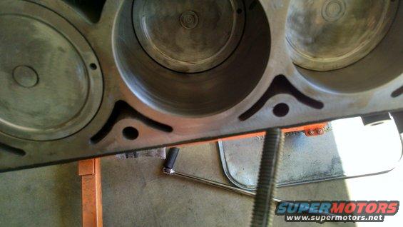 Close-up of engine block cylinders, looks like it's on an engine stand