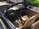 2001 Mazda Miata - Interior of a black 2001 Mazda Miata convertible with tan leather seats and dashboard.